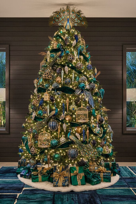 Dramatic Christmas tree decorated with peacocks