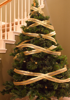 The crisscross method of putting ribbon garland on a Christmas tree